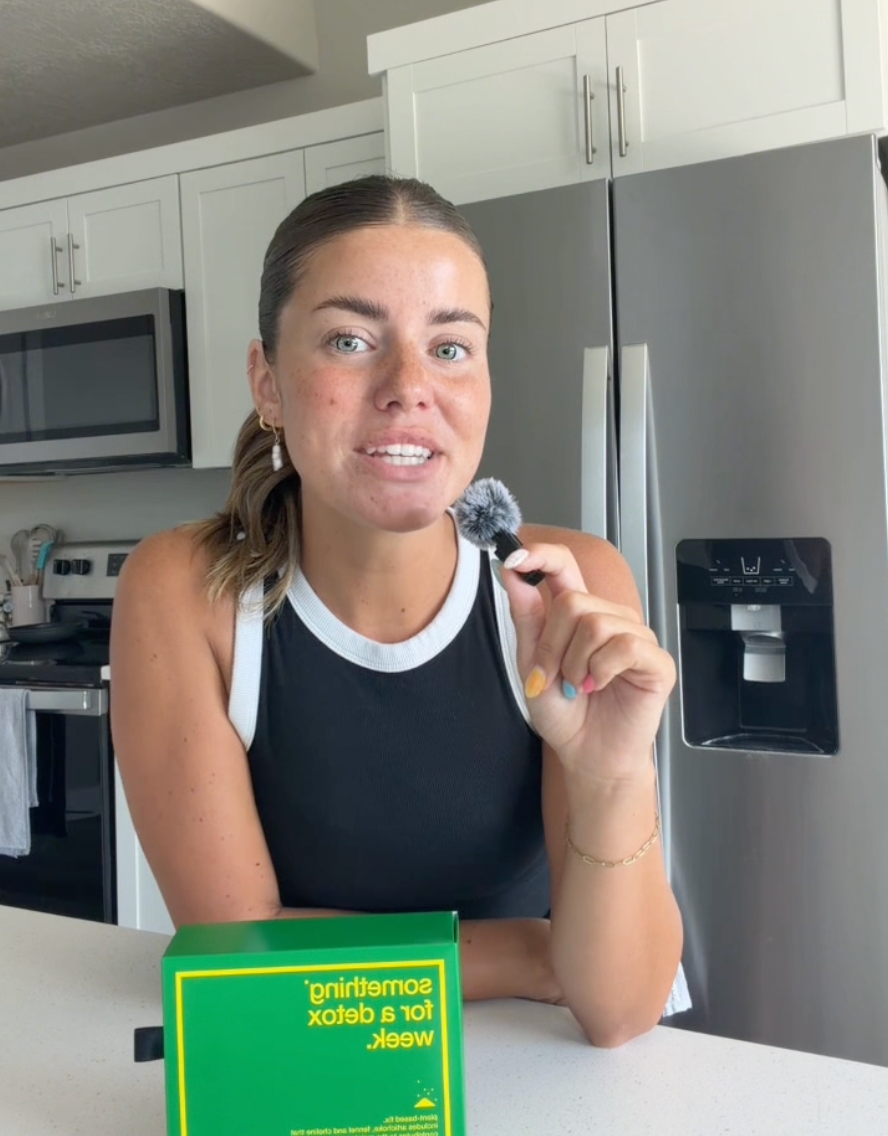 Customer with a Biocol Labs ampoule in her kitchen.